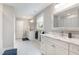 Bright bathroom with double vanity, marble countertops, and a large framed mirror at 219 Northwood Cir, Durham, NC 27701