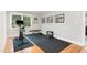 Home gym featuring rubber flooring, hardwood, and a stationary bike for all your fitness needs at 219 Northwood Cir, Durham, NC 27701