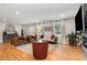Bright living room with hardwood floors, a neutral color palette, and a comfortable seating arrangement at 219 Northwood Cir, Durham, NC 27701