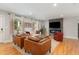 Comfortable living room with a stone fireplace, hardwood floors, and stylish decor, great for entertaining at 219 Northwood Cir, Durham, NC 27701