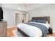 This primary bedroom offers a calm oasis, with a ceiling fan, hardwood floors, and ample natural light at 219 Northwood Cir, Durham, NC 27701