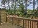 A wooden deck provides an elevated view of the lush, wooded backyard at 2201 Lambert Rd # 66, Cary, NC 27519