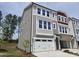 Charming three-story townhome with two car garage, neutral siding and an abundance of windows at 2201 Lambert Rd # 66, Cary, NC 27519
