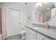 Clean bathroom with granite countertops, white cabinets and a decorative mirror at 2202 Environ Way # Bldg 2000, Chapel Hill, NC 27517