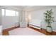 Well-lit Bedroom features a white crib, comfortable chair, pink rug and decorative accents at 2202 Environ Way # Bldg 2000, Chapel Hill, NC 27517
