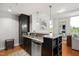 Stylish kitchen with granite countertops, modern appliances, and an island with bar seating at 2202 Environ Way # Bldg 2000, Chapel Hill, NC 27517
