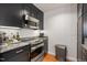 Well-equipped kitchen featuring stainless steel appliances, dark cabinets, and granite countertops at 2202 Environ Way # Bldg 2000, Chapel Hill, NC 27517