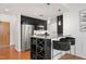 Bright kitchen featuring stainless steel appliances, a granite island, and modern bar stools at 2202 Environ Way # Bldg 2000, Chapel Hill, NC 27517