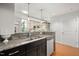 Open kitchen with a stainless steel sink, granite countertops, and modern cabinetry at 2202 Environ Way # Bldg 2000, Chapel Hill, NC 27517