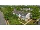 An aerial perspective of well-maintained townhomes with lush greenery and parking areas at 2210 Raven Rd # 105, Raleigh, NC 27614