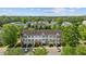 Overhead view of charming townhomes, lush landscaping, and convenient parking at 2210 Raven Rd # 105, Raleigh, NC 27614