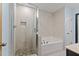 Luxurious bathroom with a walk-in shower, separate tub, and elegant tile work at 2210 Raven Rd # 105, Raleigh, NC 27614
