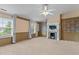 Bright bedroom featuring a fireplace, neutral walls, and large windows at 2210 Raven Rd # 105, Raleigh, NC 27614