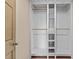 Walk-in closet with built-in shelving for optimal storage at 2210 Raven Rd # 105, Raleigh, NC 27614