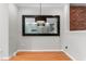Elegant dining room with hardwood floors, stylish chandelier, and a decorative mirror at 2210 Raven Rd # 105, Raleigh, NC 27614
