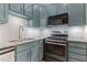 Updated kitchen featuring stainless steel appliances, and stylish backsplash at 2210 Raven Rd # 105, Raleigh, NC 27614