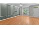 Inviting living room with wood floors, a ceiling fan, and natural light at 2210 Raven Rd # 105, Raleigh, NC 27614