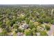Distant aerial view of a neighborhood of homes surrounded by mature trees at 2325 Sheffield Rd # 102, Raleigh, NC 27610