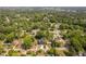 Aerial view of neighborhood homes and surrounding trees from above at 2325 Sheffield Rd # 102, Raleigh, NC 27610