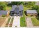 Aerial view of modern home with driveway, landscaping and surrounding neighborhood at 2325 Sheffield Rd # 102, Raleigh, NC 27610