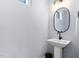 Half bathroom featuring single vanity, sleek fixtures and great lighting at 2325 Sheffield Rd # 102, Raleigh, NC 27610