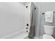 Clean and modern bathroom with white tiled walls and updated fixtures at 2325 Sheffield Rd # 102, Raleigh, NC 27610