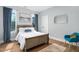 Bright bedroom with hardwood floors, natural light and comfortable decor at 2325 Sheffield Rd # 102, Raleigh, NC 27610