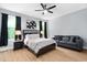 Relaxing bedroom with a king-size bed, stylish black furniture, and large windows with black-out curtains at 2325 Sheffield Rd # 102, Raleigh, NC 27610