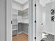 Walk-in closet with built-in shelving, and ample storage space at 2325 Sheffield Rd # 102, Raleigh, NC 27610