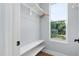 Walk in closet with wooden shelves and natural light at 2325 Sheffield Rd # 102, Raleigh, NC 27610