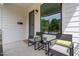 Charming front porch with stylish chairs, natural light, and manicured landscaping at 2325 Sheffield Rd # 102, Raleigh, NC 27610