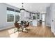 Modern kitchen with white cabinetry, stainless appliances and an adjacent dining area at 2325 Sheffield Rd # 102, Raleigh, NC 27610