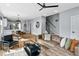 Open-concept living space with a cozy sectional, modern decor, and seamless flow to dining area at 2325 Sheffield Rd # 102, Raleigh, NC 27610