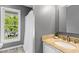 Bathroom showcasing a vanity with granite counters and a white shower curtain at 2402 Cynthia Dr, Durham, NC 27704