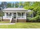 Inviting home with a covered front porch and classic architectural details at 2402 Cynthia Dr, Durham, NC 27704