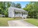 Charming single-story home showcasing curb appeal with a well-maintained front yard and inviting front porch at 2402 Cynthia Dr, Durham, NC 27704