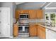 Updated kitchen with granite countertops and stainless steel appliances and bright natural lighting at 2402 Cynthia Dr, Durham, NC 27704