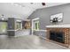 Spacious living area open to kitchen, featuring a fireplace and vaulted ceilings at 2402 Cynthia Dr, Durham, NC 27704
