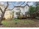 Backyard view of the home, with a deck, trees, and greenery at 244 Sweet Bay Pl, Carrboro, NC 27510