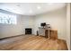 Finished basement with a modern fireplace, stylish flooring, and a window providing natural light at 244 Sweet Bay Pl, Carrboro, NC 27510