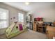 Bright bedroom with a play tent, desk, shelving, and windows providing lots of natural light at 244 Sweet Bay Pl, Carrboro, NC 27510