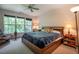Bedroom with a ceiling fan, a large window, and a comfortable bed at 244 Sweet Bay Pl, Carrboro, NC 27510