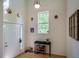 Inviting foyer featuring a high ceiling, a console table, and a striking white door at 244 Sweet Bay Pl, Carrboro, NC 27510