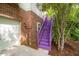 Exterior view of home with purple painted stairs and an attached one-car garage at 244 Sweet Bay Pl, Carrboro, NC 27510