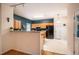 Open kitchen featuring wood cabinets, black appliances, and a peninsula with room for seating at 244 Sweet Bay Pl, Carrboro, NC 27510