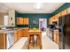 Bright eat-in kitchen with wood cabinets, ample counter space, and modern appliances at 244 Sweet Bay Pl, Carrboro, NC 27510