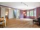 Spacious living area with hardwood floors and purple accent wall with lots of natural light at 244 Sweet Bay Pl, Carrboro, NC 27510