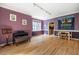 Open living room with hardwood floors, piano and lots of natural light at 244 Sweet Bay Pl, Carrboro, NC 27510