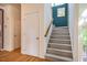 Carpeted staircase with wooden handrail and white trim at 244 Sweet Bay Pl, Carrboro, NC 27510