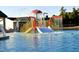 Fun waterpark with a slide, spray fountains, and shallow water for to enjoy summertime recreation at 245 Bluejay St, Clayton, NC 27520